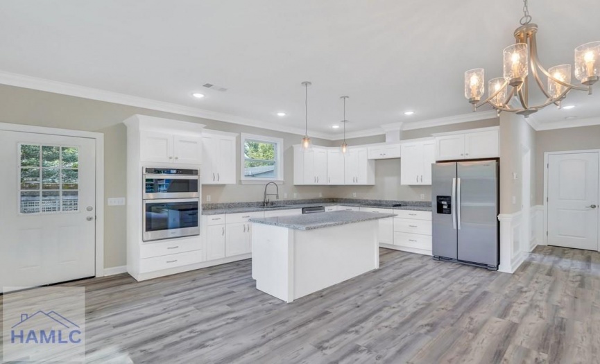 Open Concept Kitchen with an Island & Granite Coun