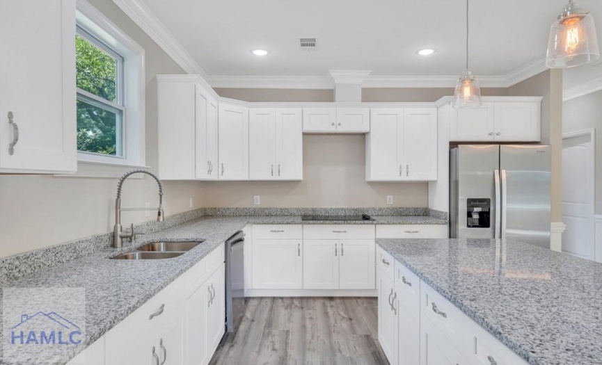 Open Concept Kitchen with an Island & Granite Coun